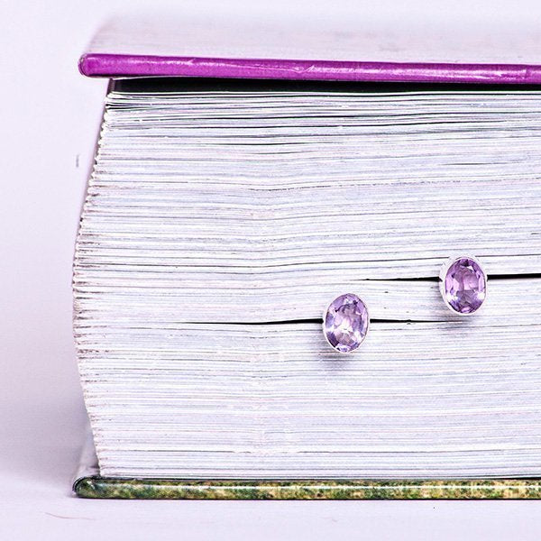 amethyst oval faceted crystal earrings with sterling silver post setting. 