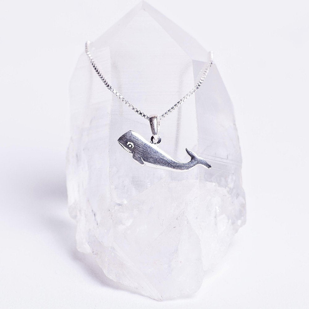 Sterling silver whale song charm necklace.