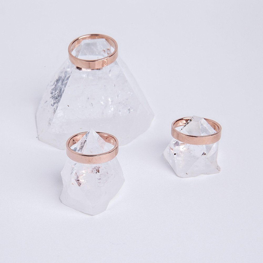 Three rose gold plated sterling band rings. Sitting atop apophyllite.
