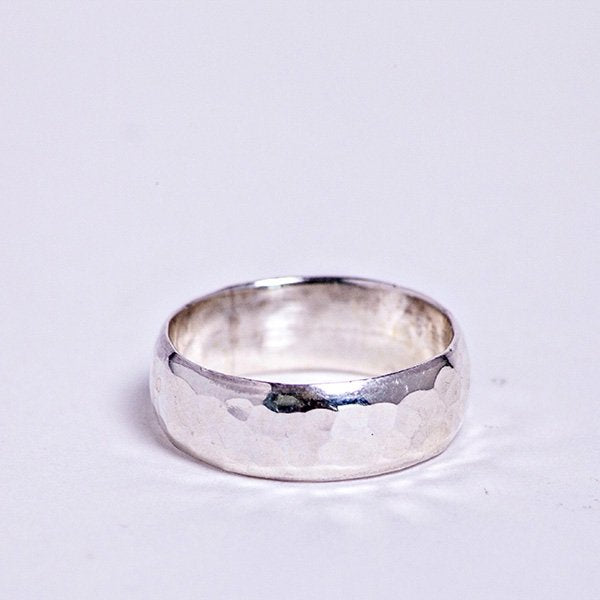 Silver hammered band ring.