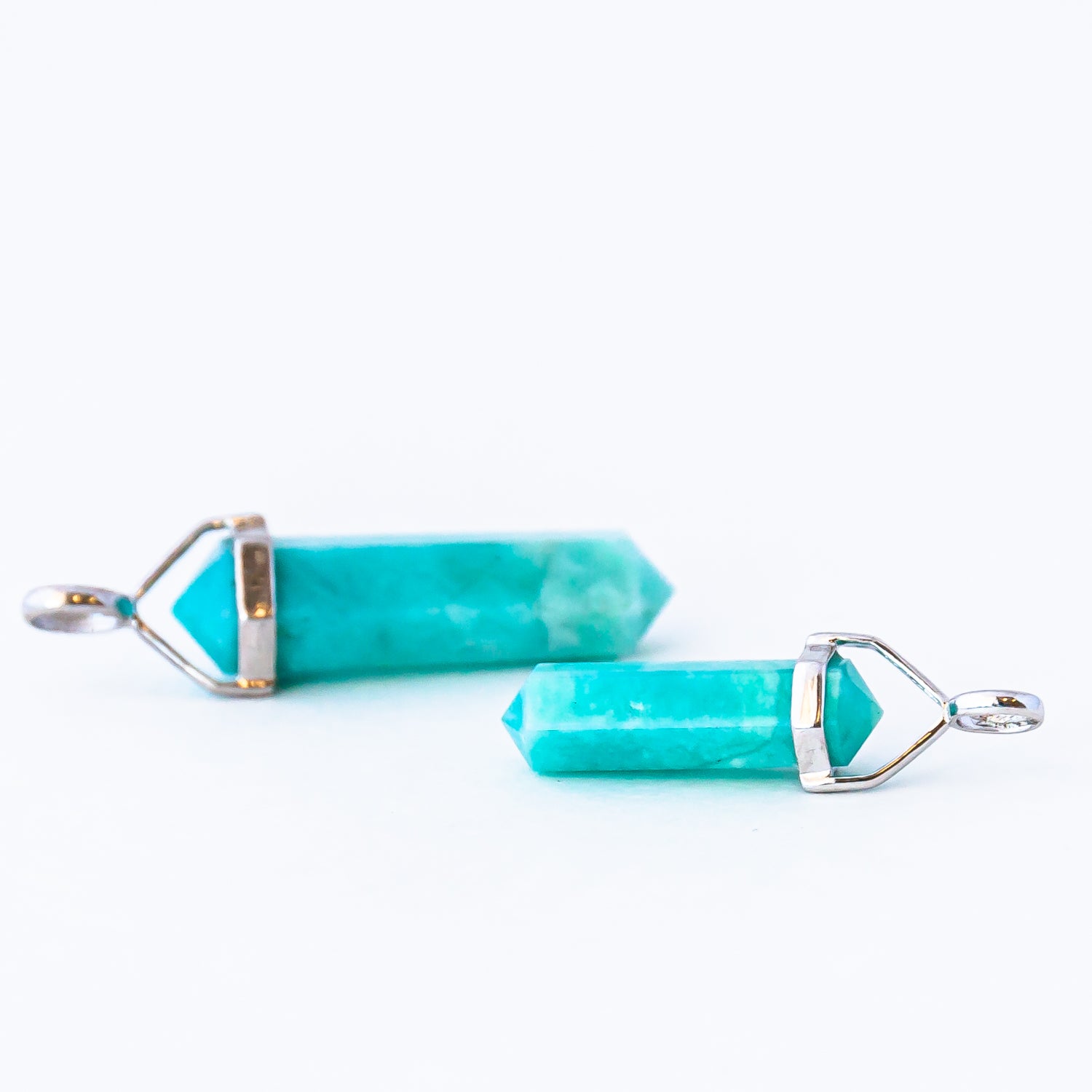 Two amazonite crystal pendants.