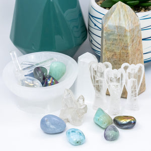 Open image in slideshow, small choir of angels crystal set close-up. 2 amazonite tumbled stones, 1 angel aura tumbled stone, 2 angelite polished stones, 1 aquamarine crystal tower,  1 chrysocolla raw stone (not pictured), 3 clear quartz crystal angels,1 clear quartz crystal cluster, 2 fluorite tumbled stones, 1 larimar polished stone, 1 selenite bowl to hold your sweet stones, 1 selenite tower, 1 set of 3 singing quartz crystals, 2 titanium aura tumbled stones.
