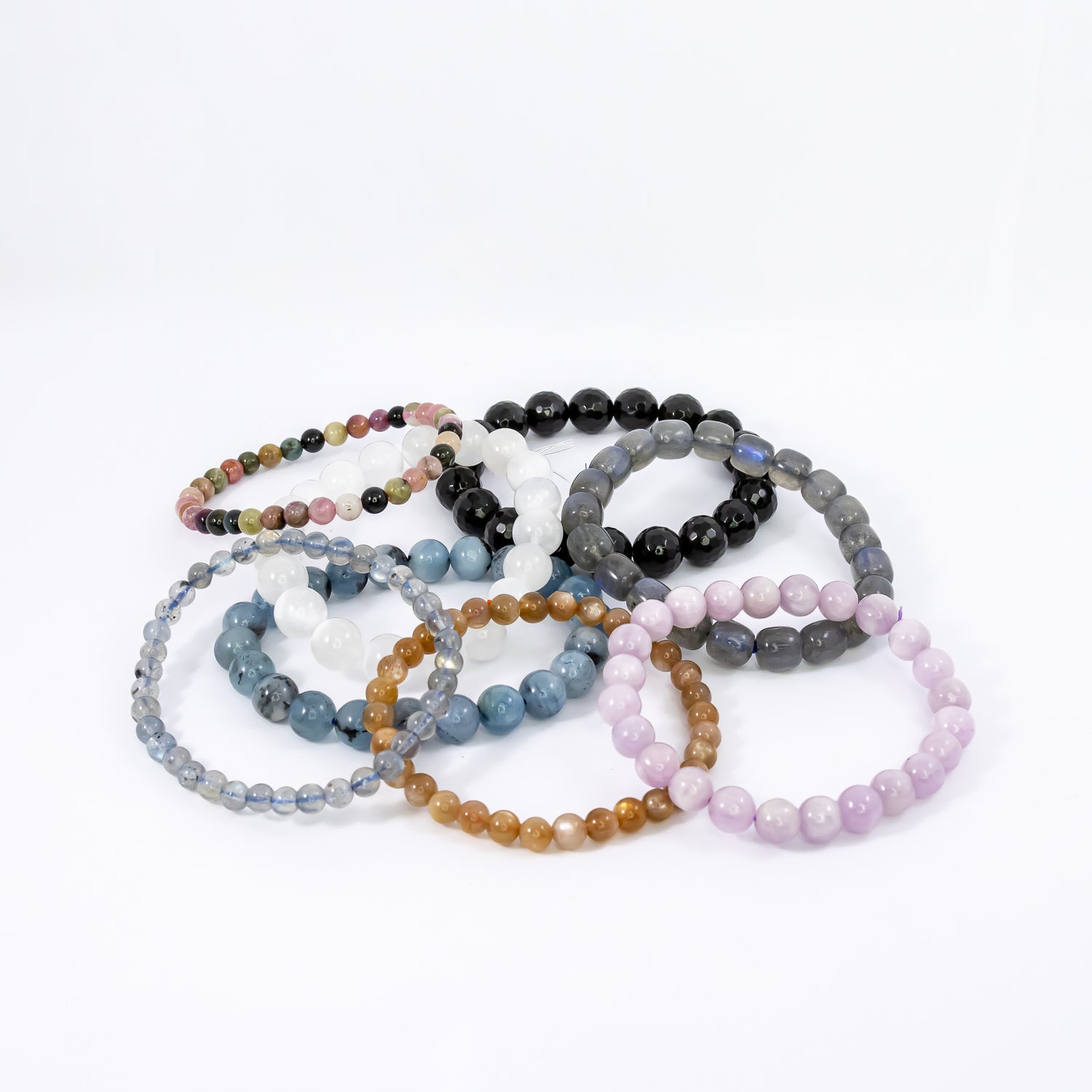 crystal bracelets. moonstone, labradorite, aquamarine, kunzite, faceted black obsidian, watermelon tourmaline, peach moonstone.