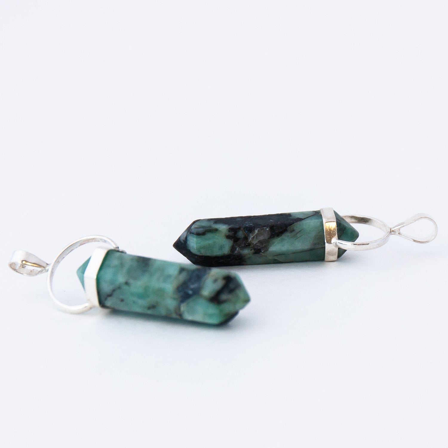 Two Emerald Crystal Pendants.