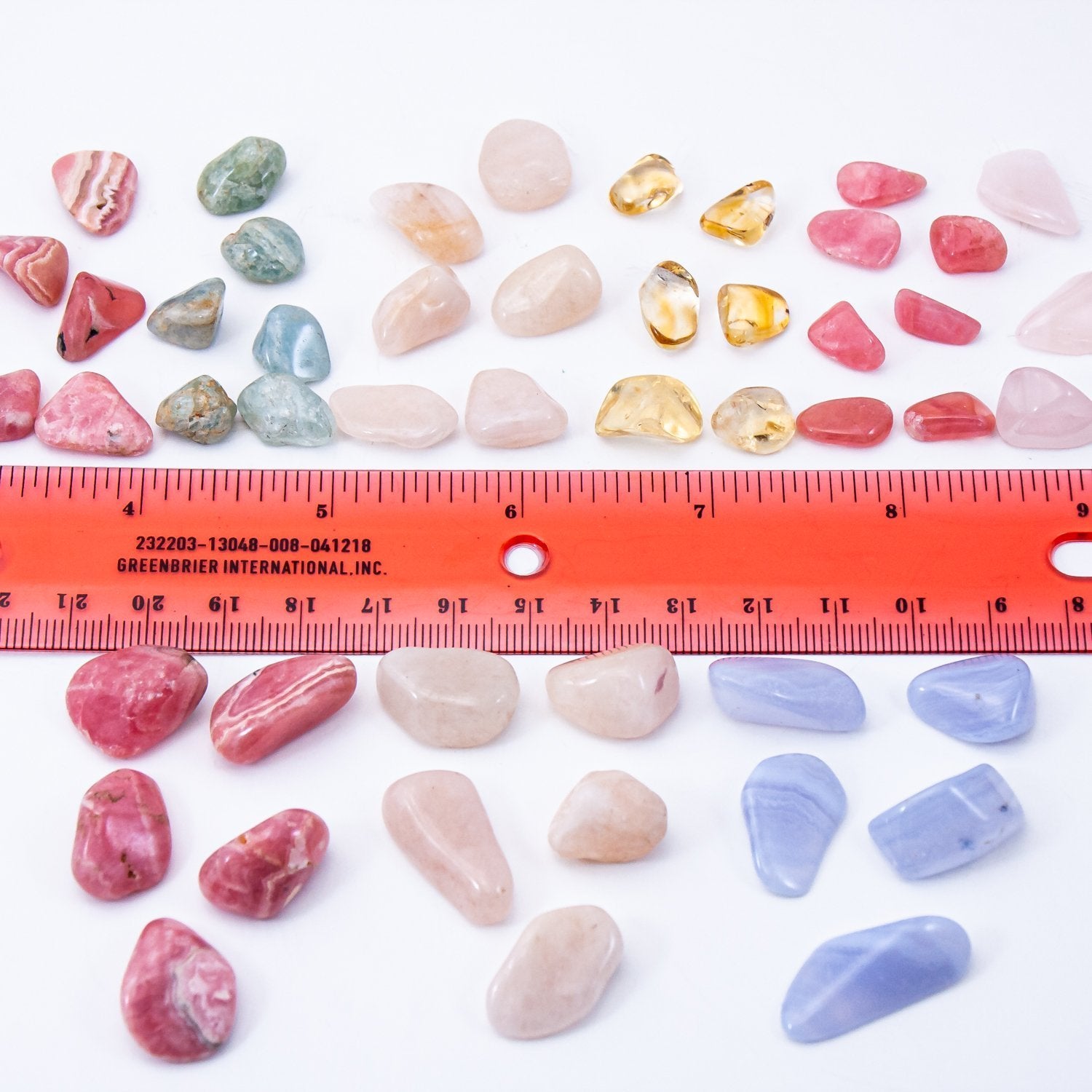 put a little love in your heart crystals. close-up small and medium stone measurements reference with ruler.