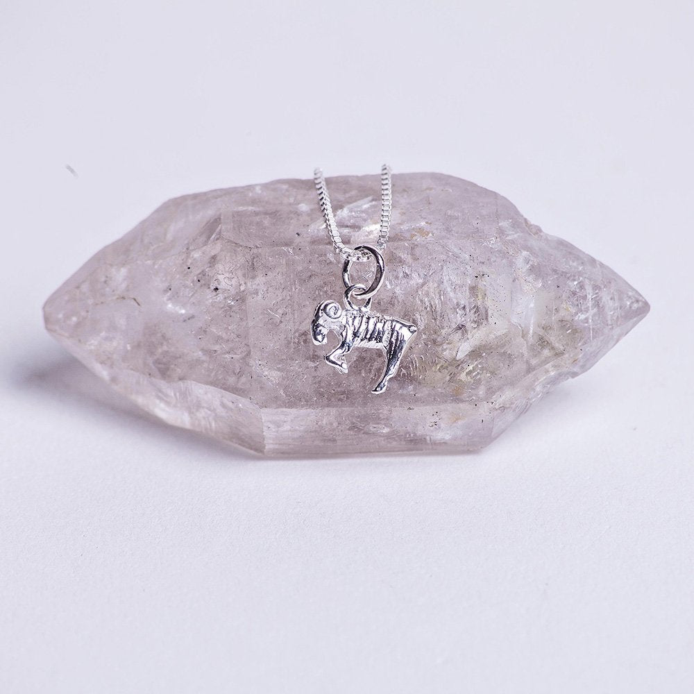 Sterling silver ram charm power balance necklace.