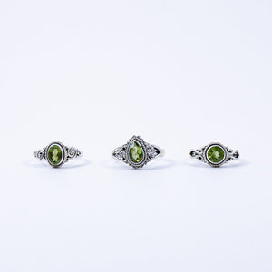Peridot positive power rings oval, round, and teardrop.